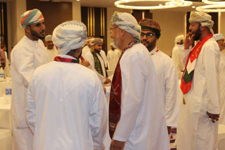 Omanis are celebrating national day and wishing each other in an fraser suites muscat banquet hall partyのeditorial素材