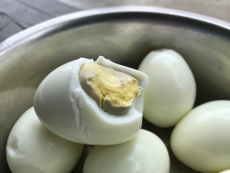 bitten boiled eggs in an pot for many people of an single indian family and is an diet healthy food