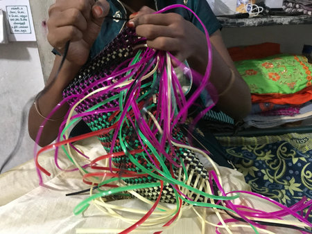 handmade plastic wire bag is being prepared at home by an lady who doing selling business