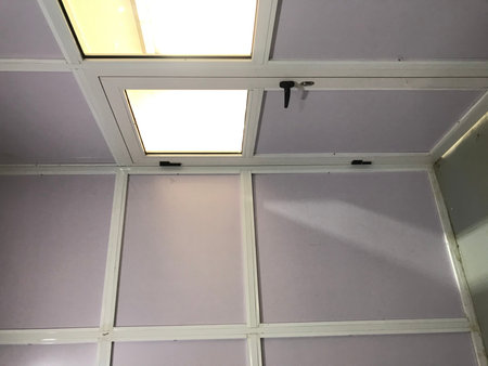 Semi glazed door and panels made of aluminum for an warehouse office installed on a concrete floor