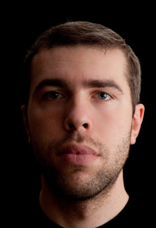 Caucasian man over black background. Portrait