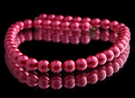 Red isolated beads over black backgroundの写真素材