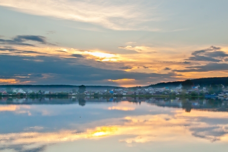 Evening sunset in the village with riverの写真素材