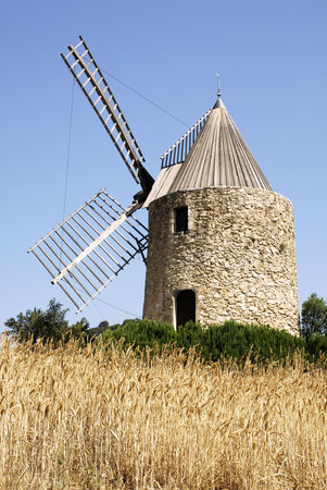 Win-mill in a wheat fieldの写真素材