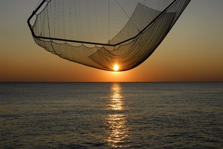 Sunset on fishing net carreletの写真素材