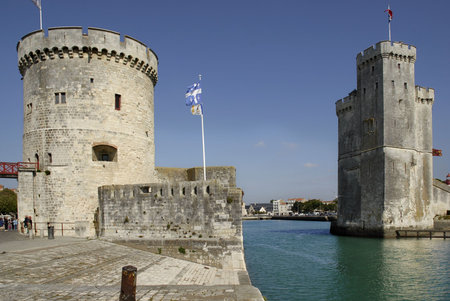 Walled entry port of La Rochelle in France,tower of the Chaine (tour de la ChaÃ®ne) on the left, tower saint Nicolas (Tour saint nicolas) on the right. Region Charente Poitouの写真素材