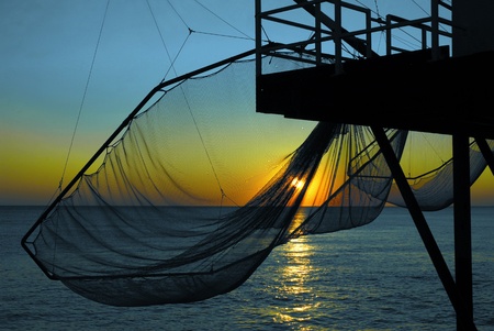 Closeup of carrelet fishing and sunset at Saint Palais in France, activity typical of the region Poitou-Charentes, department Charente Maritimeの写真素材