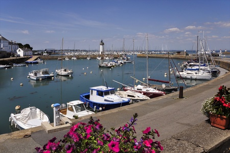 Port of Haliguen with the lighthouse at Quiberon in the Morbihan department in Brittany in north-western Franceの写真素材