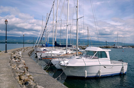 Boats in the port of Nernier, commune in the Haute-Savoie department in the Rhône-Alpes region in...