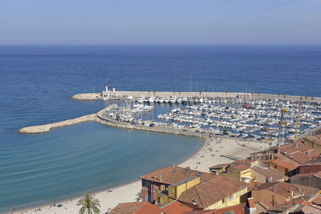 Aerial view of harbor, beach and town of Menton, a town in the Alpes-Maritimes department in the Provence-Alpes-French Riviera area in southeastern France.の写真素材