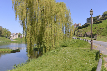 Pond and weeping willow at Falaise, a commune in the Calvados department in the Basse-Normandie region in northwestern Franceの写真素材