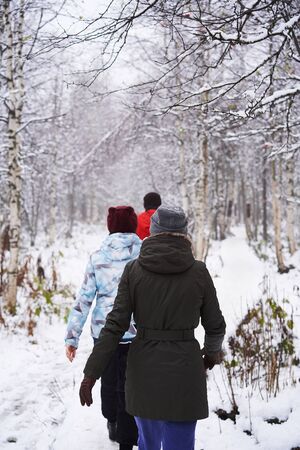 A group of people cross country skiing in the snowの写真素材