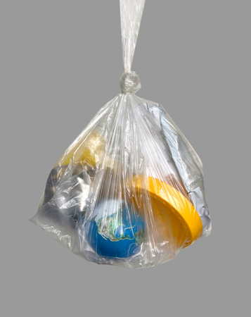 Globe in trash bag, concept of waste, climate change and global ecological problemsの写真素材