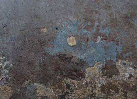 Old paint weathered rough grey crumbling plaster concrete wall texture