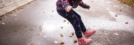High jump over a pool of water on an autumn dayの写真素材