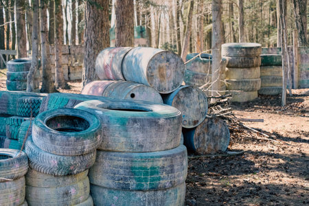 Walls of tires in the woods, paintball arenaの写真素材