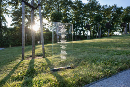 Markowa, Poland - September 2023, Ulma Family Museum of Poles Saving Jews in World War II, transparent plaques of towns and villages helping Jews in the orchard of remembrance, Ulmowie z Markowej, Polska Rodzina UlmÃ³wのeditorial素材