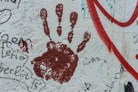 Hand mark painting and wall graffiti closeupの写真素材