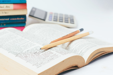 Close up  pencil with dictionary on white backgroundの写真素材
