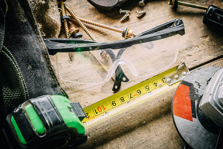 Different tools on a wooden background.