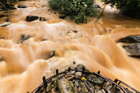 Mud and water pouring down after very heavy rain.の写真素材