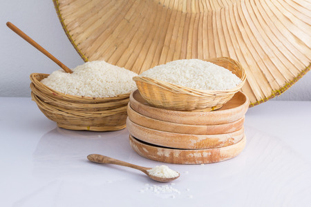 Raw and uncooked rice in basket weave,shallow Depth of Field,Focus on rice.の写真素材