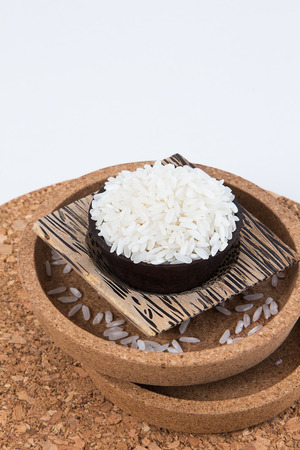 Raw and uncooked rice in basket weave,shallow Depth of Field,Focus on rice.の写真素材