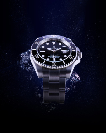 Bangkok, Thailand -  March 25, 2016: Luxurious wrist watch from Rolex for men on water background. Studio shot in Bangkok, Thailand.のeditorial素材