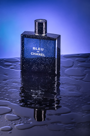 Bangkok, Thailand - November 14, 2014 : Perfume in blue bottle with water droplets.のeditorial素材