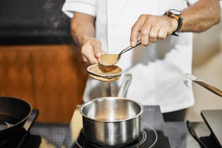 Chef cooking in a kitchen.の写真素材