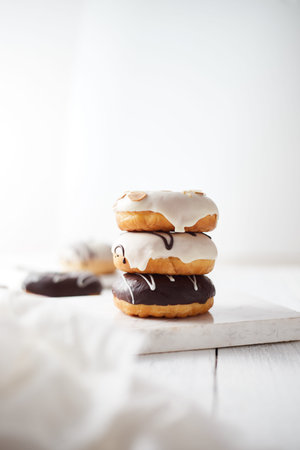 Different donuts on wooden table.