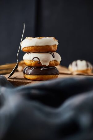 Different donuts on wooden table.の写真素材