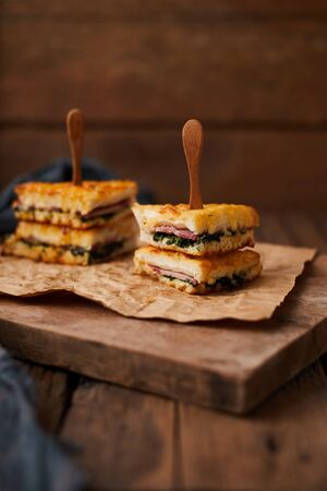 Baked spinach and ham sandwich with sauce.の写真素材