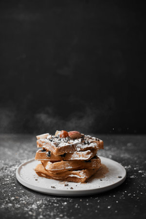 Homemade waffles with fruit and granola.