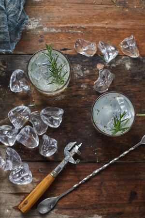lemonade in glass with rosemary. の写真素材
