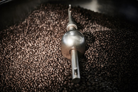 Freshly roasted coffee beans in a coffee roaster.Frozen moment.