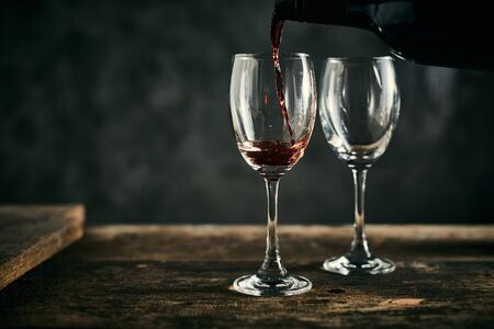 Red wine on wood background.の写真素材