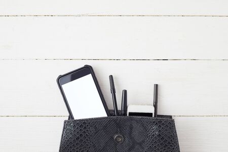 White office desk table with smartphone.Top viewの写真素材