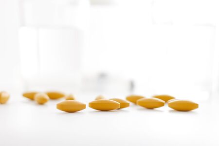 Close up medical pills on blur background.の写真素材