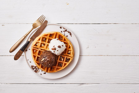 fresh waffle with ice cream and caramel sauce.の写真素材