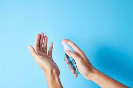 Closeup bottle of blue alcohol hand spray. corona virus concept
