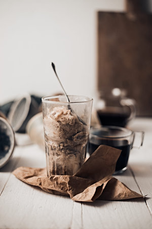 Cold homemade ice cream on white table background.