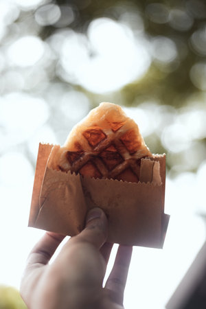 Homemade Croissant Waffle (Croffle) on wood background.の写真素材