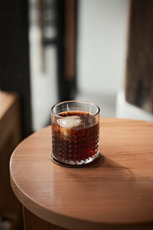 black drip coffee in glass cup.