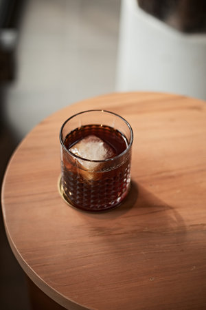 black drip coffee in glass cup.