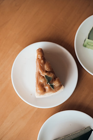 Caramel macadamia cheesecake on the wooden tableの写真素材