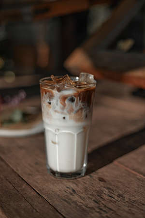 iced latte coffee in a glass with cold milk.の写真素材
