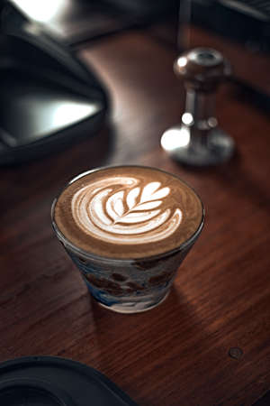 Selective focus cup of hot latte art coffee,focus at white foamの写真素材