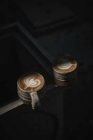 Selective focus cup of hot latte art coffee,focus at white foamの写真素材