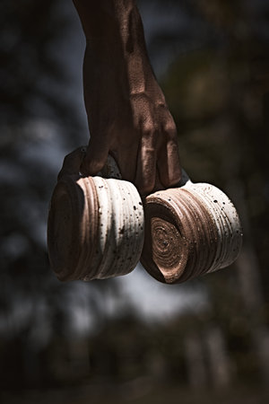 Hand holding a cup of coffee on blur background.の写真素材
